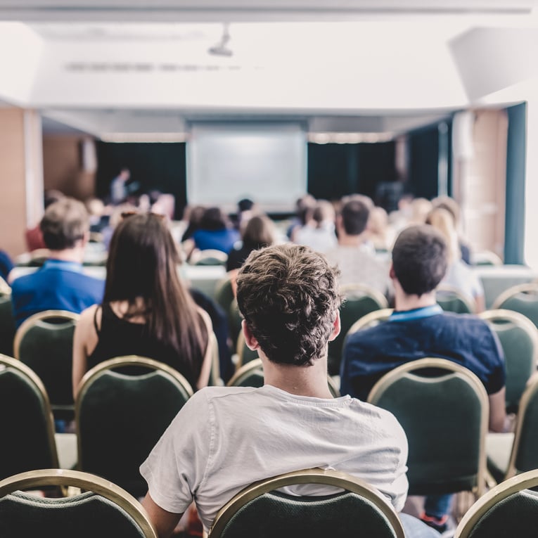 Audience in Lecture Hall at a Business Conference.